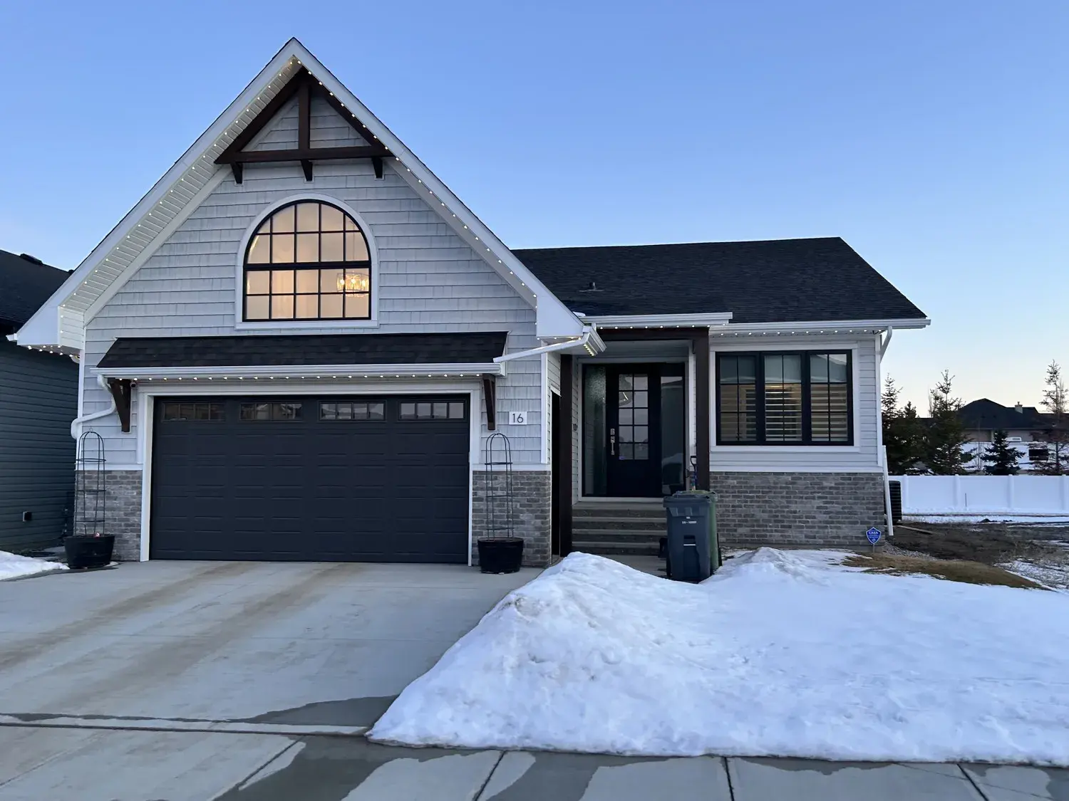 Cape Cod-style Red Deer home with a completed seamless 6-inch eavestrough and clean fascia running the full roofline