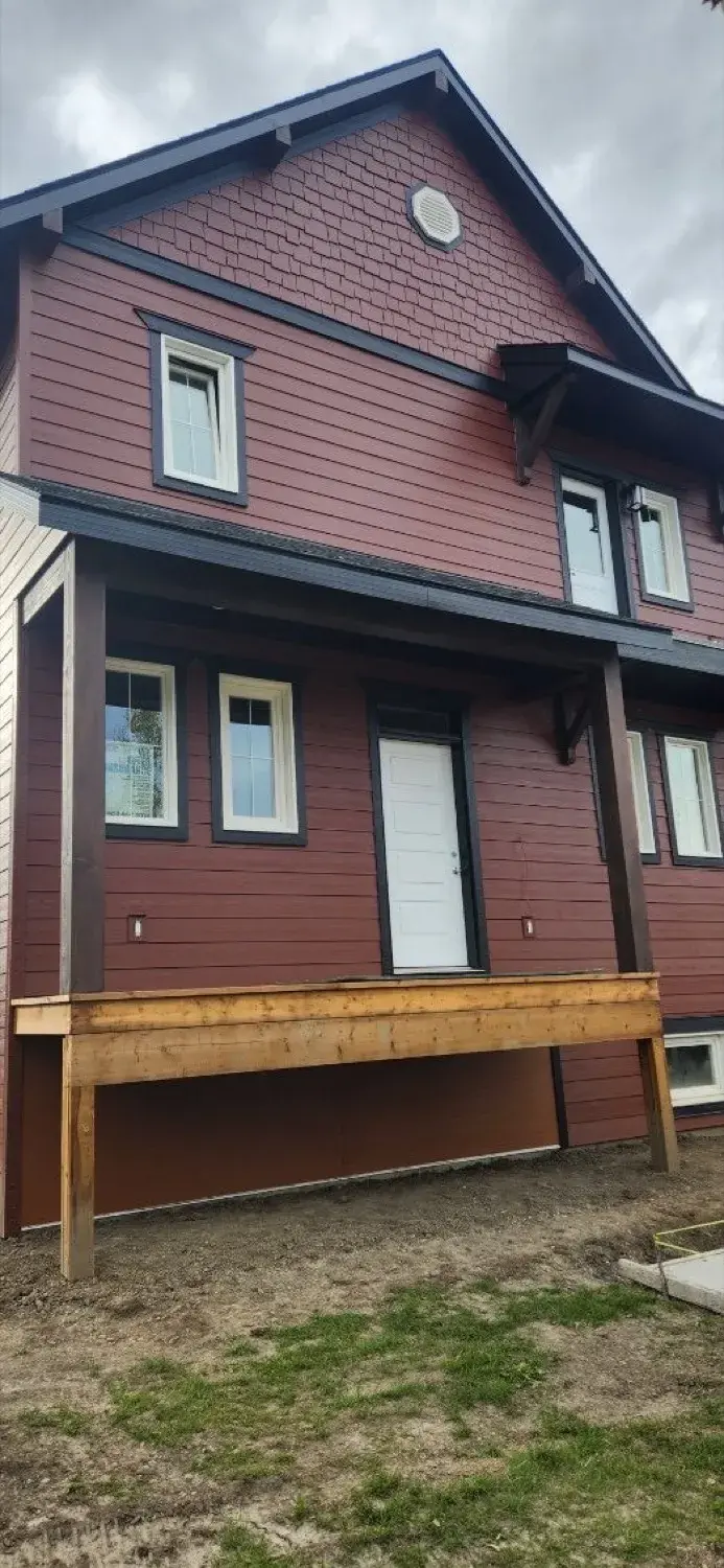 Close-up of matching LP SmartSide panels installed beside original siding on a Central Alberta home