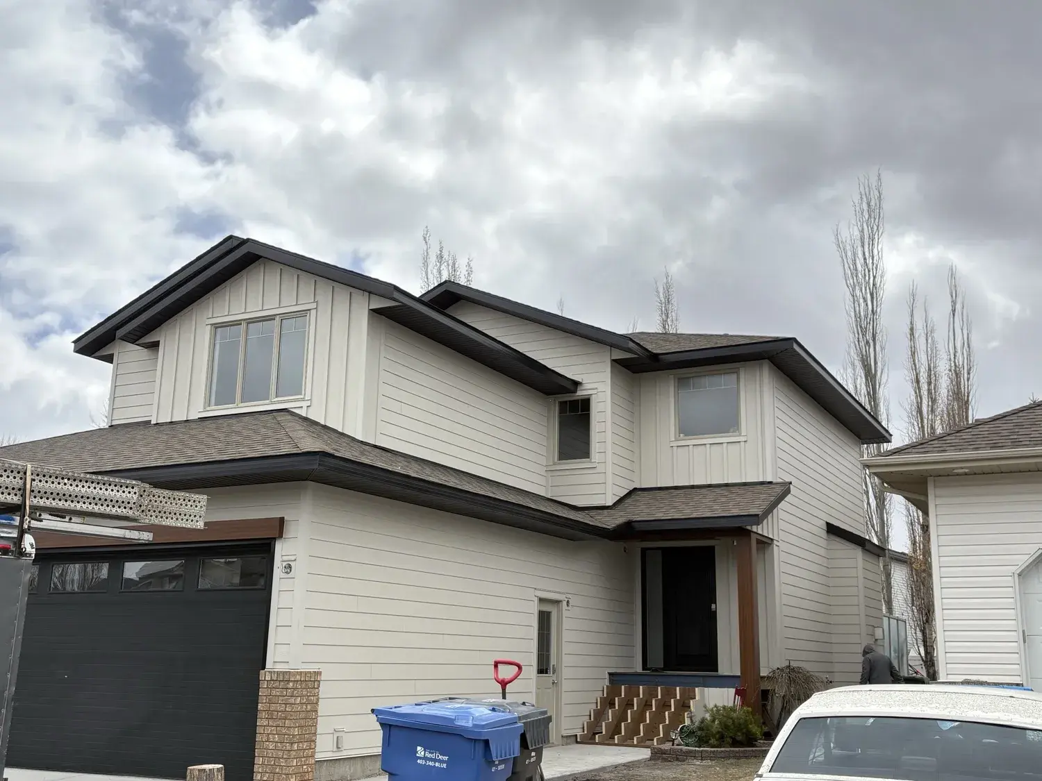 Exterior siding and soffit repair work on a Central Alberta home