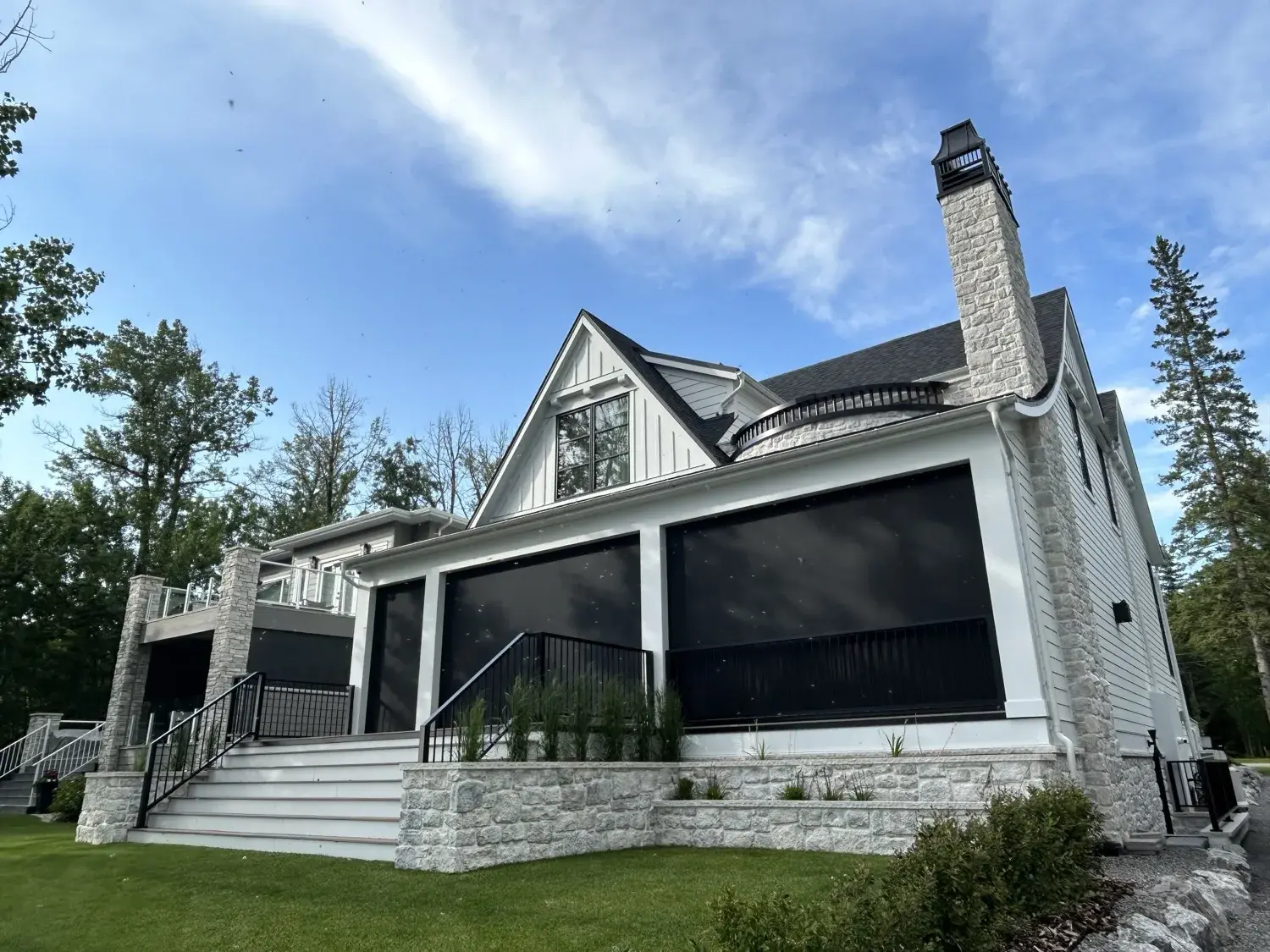 Wizard motorized screen room on a lakefront deck in Central Alberta